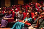 Audience members seated in red auditorium chairs during IUB Astronomy Night I.