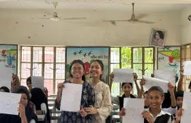 Students proudly holding up their hand-drawn constellation patterns during the Durbin workshop at Moneshwar Government Primary School.